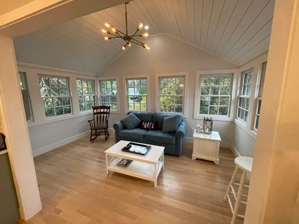 Yarmouth Port Cape Cod vacation rental - Sunroom with beautiful view of backyard and full size sofa bed.