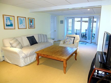 East Orleans Cape Cod vacation rental - Downstairs family room with TV, French doors to back yard