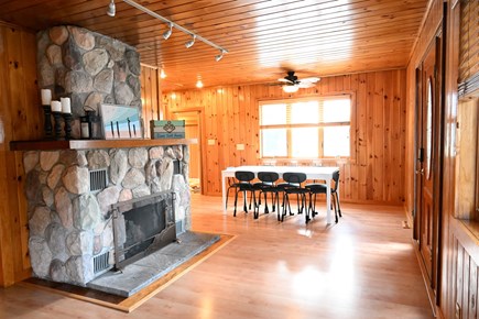 Onset MA vacation rental - Open living space with fieldstone fireplace