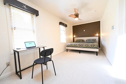 Onset MA vacation rental - Primary bedroom with skylight and work station
