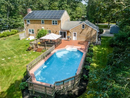 Marstons Mills Cape Cod vacation rental - View of back yard with pool.