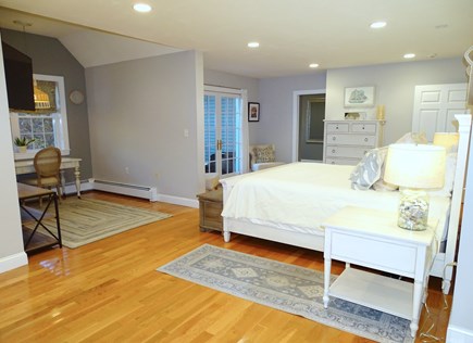 Falmouth Cape Cod vacation rental - Master bedroom showing office area and French Doors to upper deck