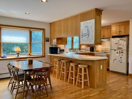 Wellfleet Cape Cod vacation rental - Kitchen table, kitchen counter bar stools, and kitchen.