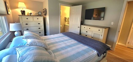 Harwichport Cape Cod vacation rental - Bedroom 1. Queen bed with half bathroom and smart tv