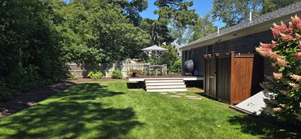 Harwichport Cape Cod vacation rental - Large private backyard with outdoor shower. Large seating area.