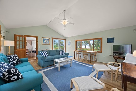 Wellfleet Cape Cod vacation rental - Spacious room with a TV, dining table, and lots of natural light