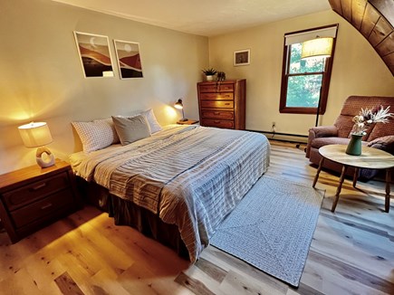 Marstons Mills Cape Cod vacation rental - Bedroom with a comfortable bed and a cozy recliner