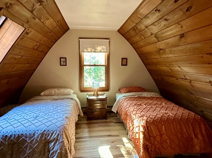 Marstons Mills Cape Cod vacation rental - Rustic charm meets comfort in our wooden cabin's twin bedroom
