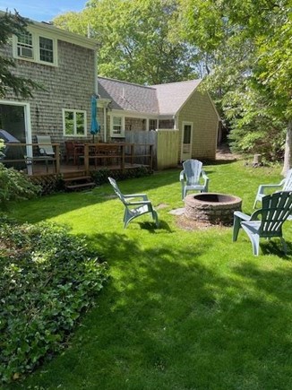 Harwich Center Cape Cod vacation rental - Back yard with deck, grill, outdoor shower and fire pit