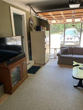 Harwich Center Cape Cod vacation rental - Screened in garage bonus room w/ Smart TV, bar and extra fridge