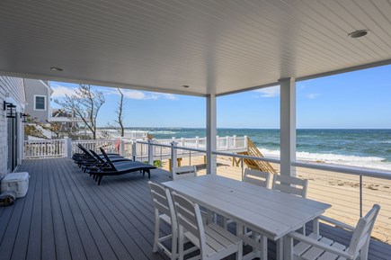 Sandwich Cape Cod vacation rental - Ocean front lower back deck with seating.