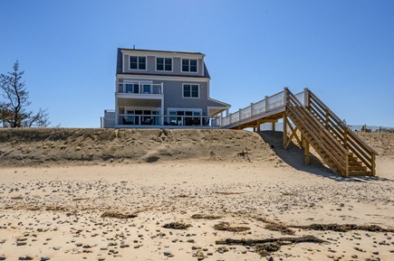 East Sandwich Cape Cod vacation rental - Back of the home with stairway to the private beach.