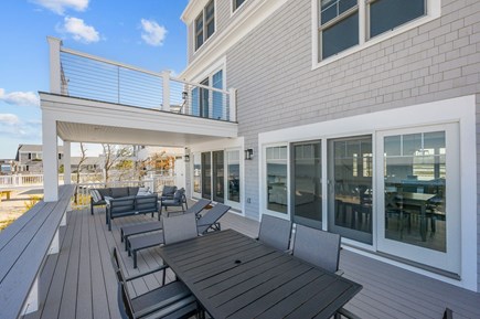 East Sandwich Cape Cod vacation rental - Bar height ledge along back railing of deck.