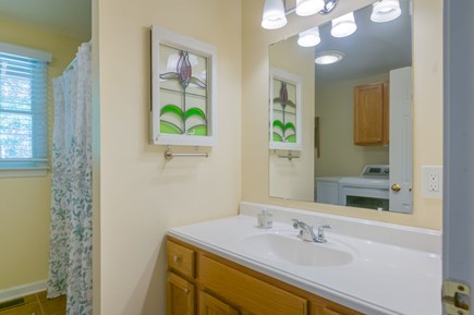 Mashpee Cape Cod vacation rental - Bathroom 1 - Shower/tub combo w/ washer and dryer.