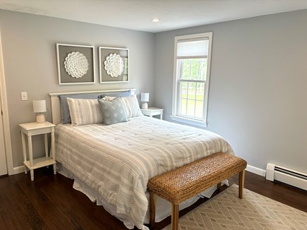 East Falmouth Cape Cod vacation rental - First floor master bedroom with two dressers and two closets