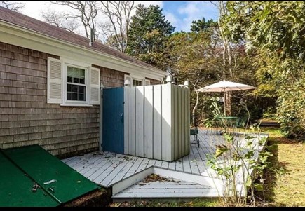 Eastham Cape Cod vacation rental - Back deck, out door shower, hatchway entrance to basement.