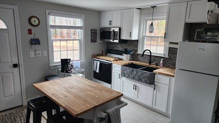 Eastham Cape Cod vacation rental - New cabinets, sink, counters, and microwave and a coffee station.