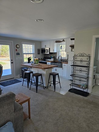 Eastham Cape Cod vacation rental - Kitchen looking in from screen porch, new island counter top.