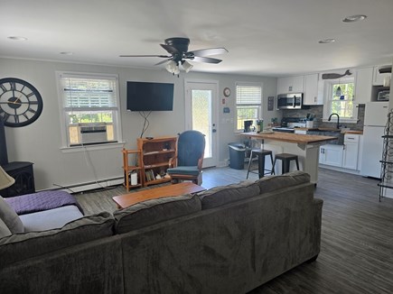 Eastham Cape Cod vacation rental - Screen porch entrance looking into living/kitchen, new flooring