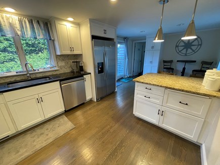 Harwich Cape Cod vacation rental - Kitchen - to master Bedroom, shows slider to back deck