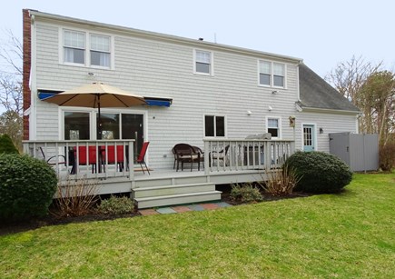 Harwich Cape Cod vacation rental - Back deck with new dining area, grill