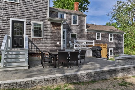 Yarmouth Port Cape Cod vacation rental - Stone patio with plenty of seating & Weber gas grill
