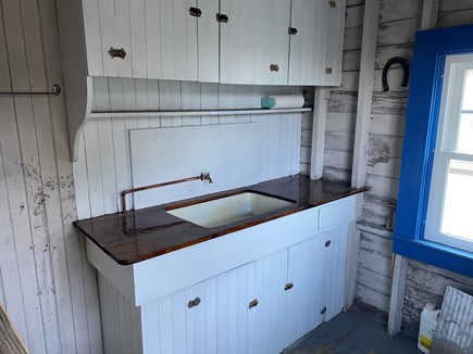 North Falmouth Cape Cod vacation rental - Boathouse has fresh water sink and small fridge for drinks