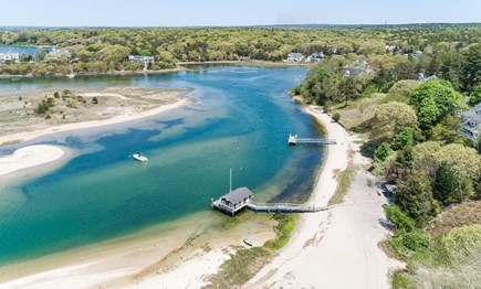 North Falmouth Cape Cod vacation rental - Aerial of private beach, boathouse, and dock w house on bluff