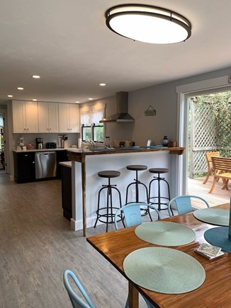 Eastham Cape Cod vacation rental - View into kitchen with bar and stools