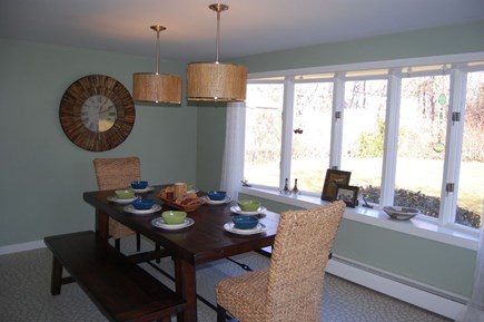 Hyannis Cape Cod vacation rental - Dining room with view of the backyard  seating for 8 people.
