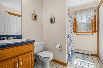 Dennis Cape Cod vacation rental - First floor bathroom with laundry closet