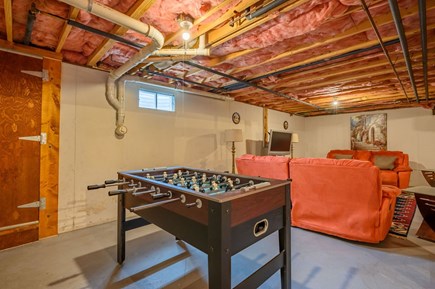Dennis Cape Cod vacation rental - Lower level living space with tv and foosball table