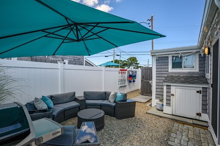 Dennis Port Cape Cod vacation rental - Outdoor seating with large umbrella