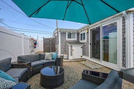 Dennis Port Cape Cod vacation rental - Outdoor seating with large umbrella