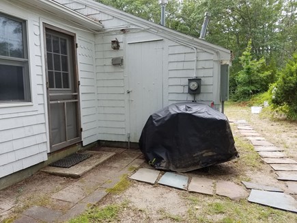 Yarmouth Cape Cod vacation rental - Grill and path to the outdoor shower.