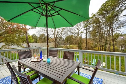 Harwich Cape Cod vacation rental - Deck dining area overlooking the backyard