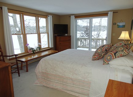 Centerville Cape Cod vacation rental - Master bedroom on first floor with slider to deck