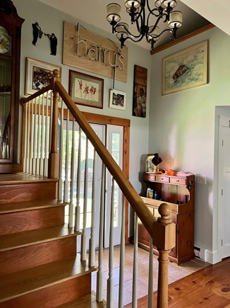 Centerville Cape Cod vacation rental - Entry way with “Harry’s Blues Bar memorabilia