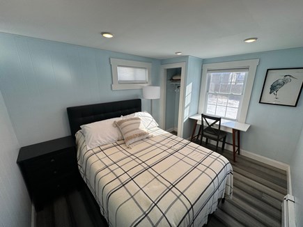 Yarmouth Cape Cod vacation rental - Full bed with closet and desk set up with backyard view