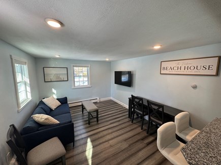 Yarmouth Cape Cod vacation rental - Living room with smart TV and fold down desk/dining table