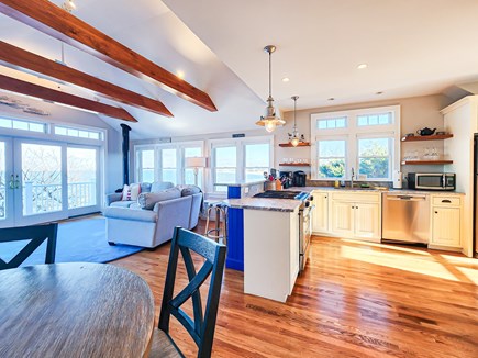 Brewster Cape Cod vacation rental - Open upper level living area, with dining table, sectional, TV