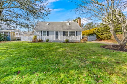 West Yarmouth Cape Cod vacation rental - Front yard with a porch that overlooks a small bay