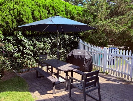 West Yarmouth Cape Cod vacation rental - Patio off the kitchen with table and grill