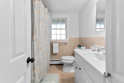 West Yarmouth Cape Cod vacation rental - Main floor full bathroom with full size washer/dryer in closet