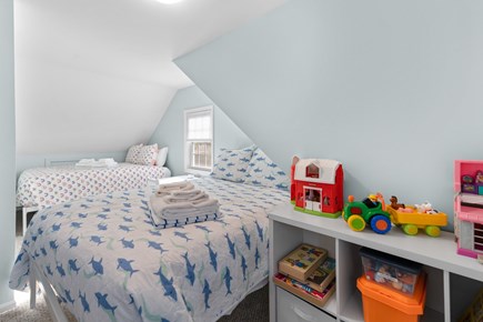 West Yarmouth Cape Cod vacation rental - Second floor bedroom with toys, two full beds, exit to balcony