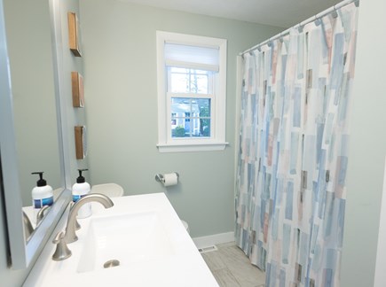 Dennisport Cape Cod vacation rental - Main floor bathroom with full-sized tub/ shower combo.