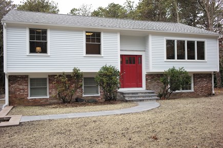 Brewster Cape Cod vacation rental - Home exterior: Landscaping was just completed. Grass by summer!