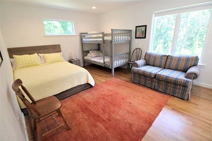 Eastham Cape Cod vacation rental - Bedroom with queen and bunk beds, couch, ensuie bath with tub