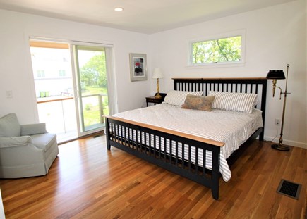 Eastham Cape Cod vacation rental - Primary bedroom with balcony and ensuite