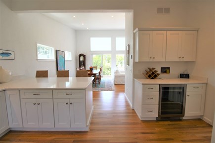 Eastham Cape Cod vacation rental - Kitchen space to living space (wet bar and 1/2 bath to right)